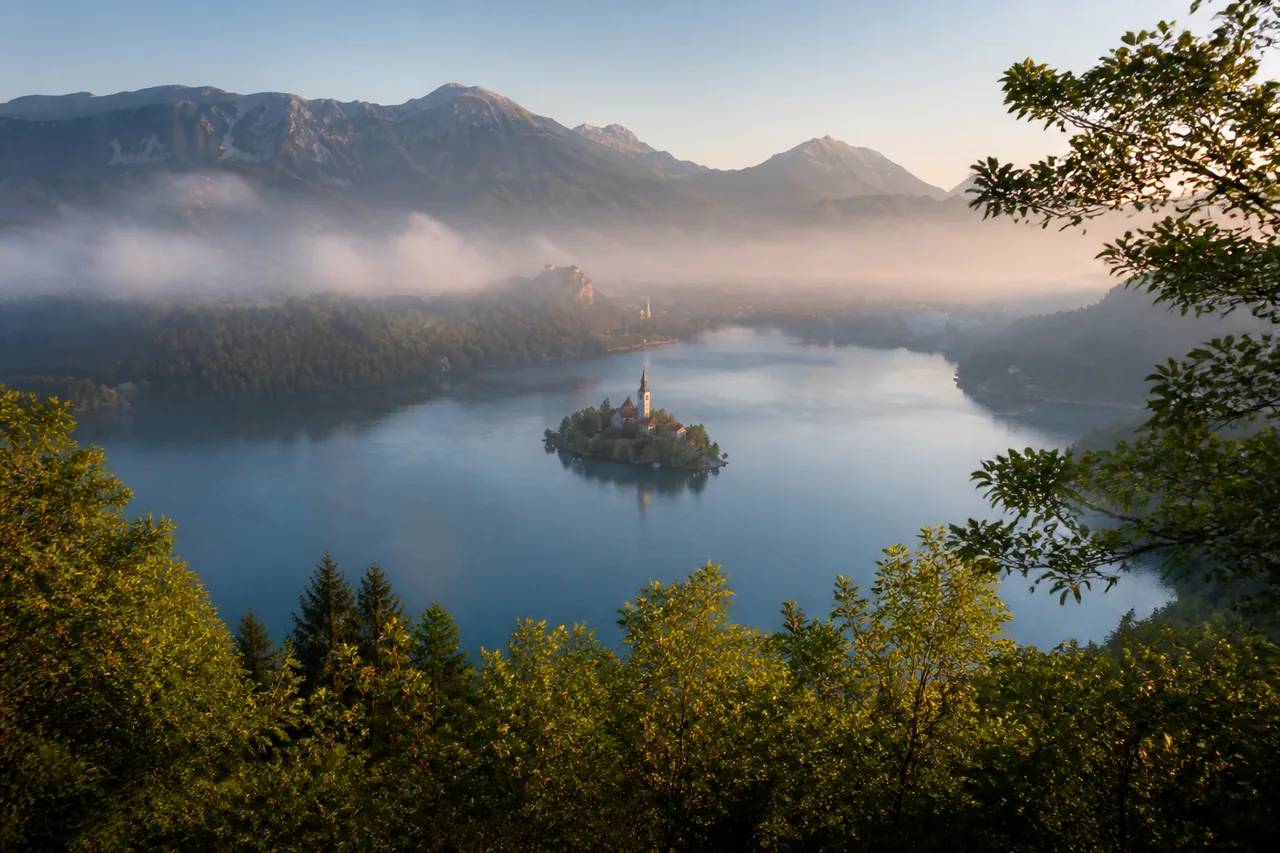Lake Bled and its island church in the morning mist